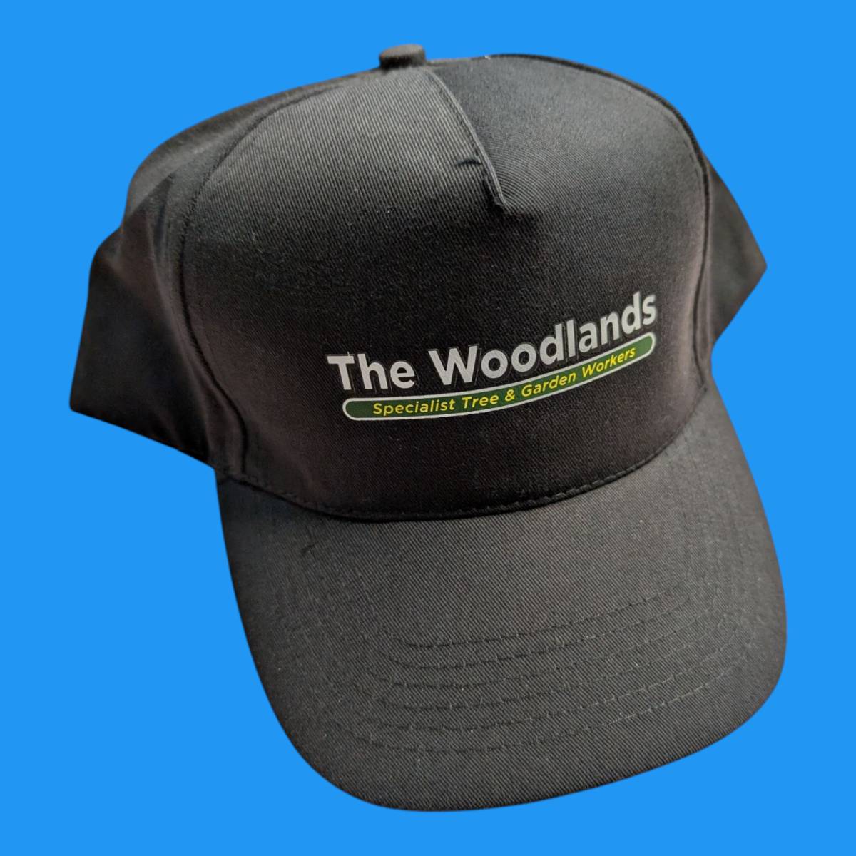 Printed cap with logo on front of a black cap