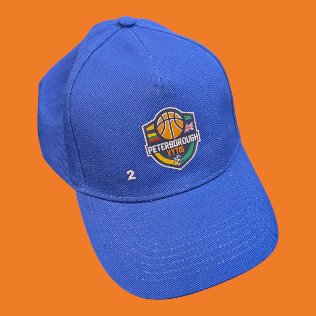 Printed cap with logo on front of a black cap