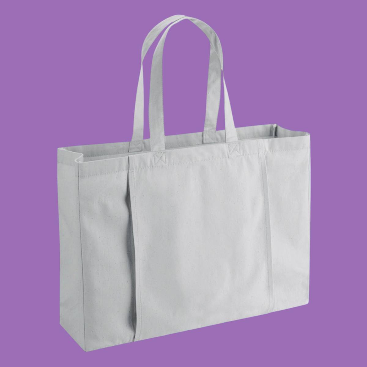 A large, light grey coloured tote bag with a sleeve on the side designed for a yoga mat