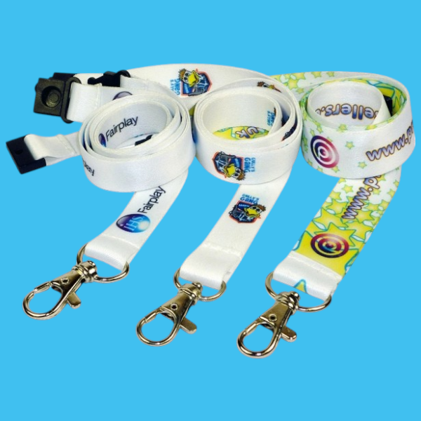 Three predominantly white lanyards rolled up in a row star design on one