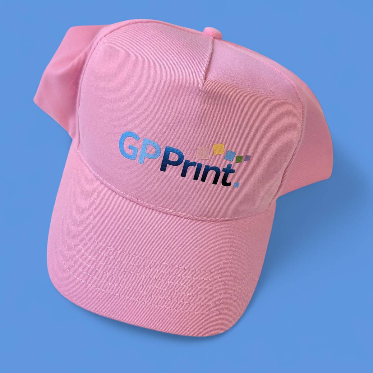 A pink cap featuring the company logo