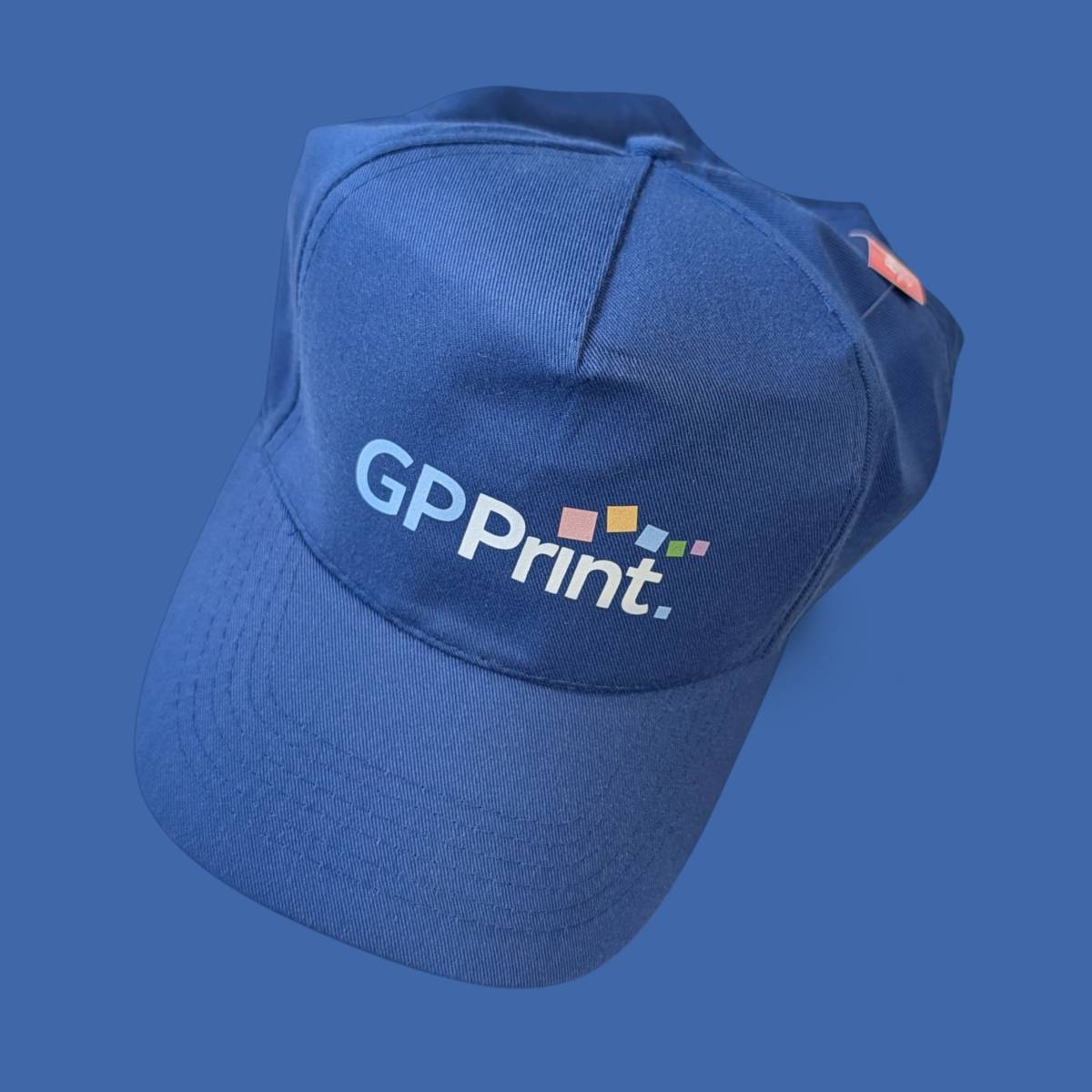 A blue cap featuring the company logo